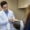 Dr. Donald T. McDonald of Wisconsin Foot & Ankle Clinic explaining foot anatomy to a patient using a medical model during a consultation.